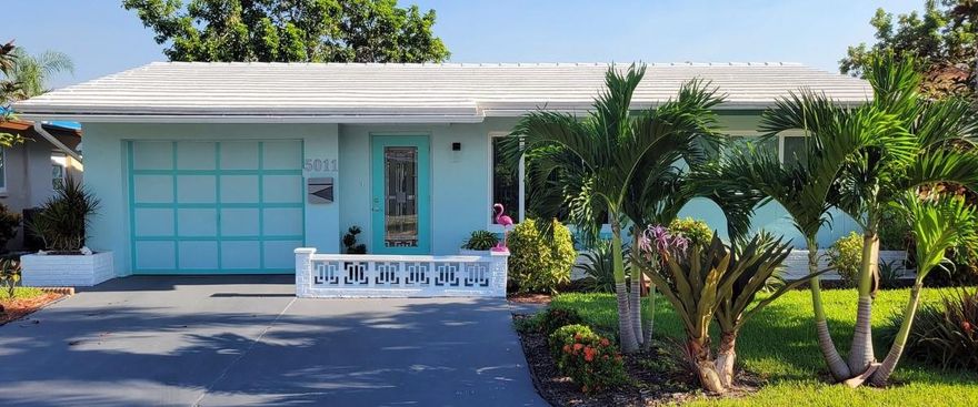 Updated and meticulously maintained, this 2 bedroom, 1 +1/2 bathrooms home is in a lovely 55+ community.  Lush landscaping - carefully planned for beauty and privacy. Many renovations and upgrades done from 2022 to present: a remodeled kitchen with new stainless appliances and Corian countertops;  laminate flooring; ceiling fans; window treatments; freshly painted interior/exterior; impact windows and front door in the main house. An open floor plan for entertaining and mobility. Within a quiet, welcoming community convenient to key roadways, shopping, entertainment, restaurants, and health care services. With two community pools – one heated and a fully renovated Clubhouse you'll have an array of social opportunities.  Come to see the good life that awaits you here.