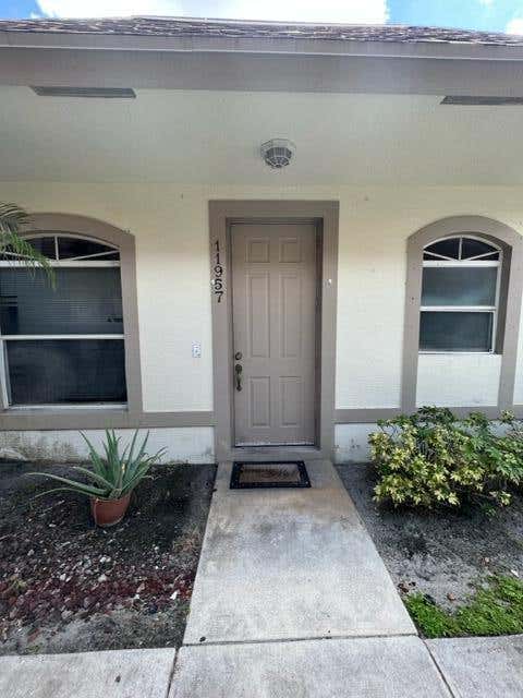 Photo of 11957 Sturbridge Lane, Wellington, FL 33414 (MLS # B26060273)