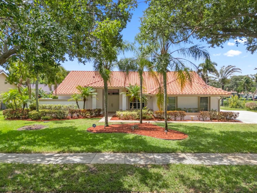 Serene expansive lake views in highly sought after quaint neighborhood of only 42 beautifully maintained homes.  Lush tree lined streets lead to this stunning 3 bed 2 bath offering the perfect blend of privacy and carefree Florida living.  Foyer entrance leads to over 2200 sf open, spacious split bedroom floor plan.  Most rooms have sliders to large covered back patio and screened pool.  Large kitchen and all good sized bedrooms w/custom closet cabinetry.  Large laundry room with closet, shelving, countertop and sink.  Generac generator on home.  One of best locations in neighborhood!  Incredible opportunity to own a piece a paradise.