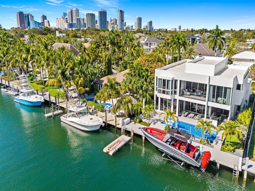 PRIME HISTORIC RIO VISTA LOCATION! NO FIXED BRIDGE SOUTHERN EXPOSURE! BACK YARD FACES PREVAILING SEA BREEZES AND PRIME SUNSHINE YEAR ROUND!  ONE BLOCK TO THE YACHT CLUB! BRAND NEW CUSTOM CONTEMPORARY WITH SUPER PREMIUM FINISHES! WALLED AND GATED COMPOUND! 5 CAR GARAGE! 75' OF PROTECTED DOCKAGE JUST 5 MINUTES TO PORT EVERGLADES! SUPER WIDE CANAL, 125' ACROSS! POTENTIAL TO PURCHASE VACANT LOT NEXT DOOR WOULD GIVE YOU 150 FEET DOCKAGE! DESIGNED BY TUTHILL ARCHITECTURE & CUSTOM BUILT BY SBC CONSTRUCTION! 5 BEDROOM SUITES & 5.5 BATHROOMS AND A TOTAL OF 7,300SF OF INDOOR AND OUTDOOR AREA! EXCEPTIONAL FINISHES, TWO LAUNDRY ROOMS, MARVIN SIGNATURE COASTLINE WINDOWS, INFINITY EDGE SALTWATER POOL AND SPA, ELEVATOR, ITALIAN CABINETRY AND EXTENSIVE OUTDOOR KITCHEN AREA FOR GRAND SOUTH FLORIDA LIVING!
