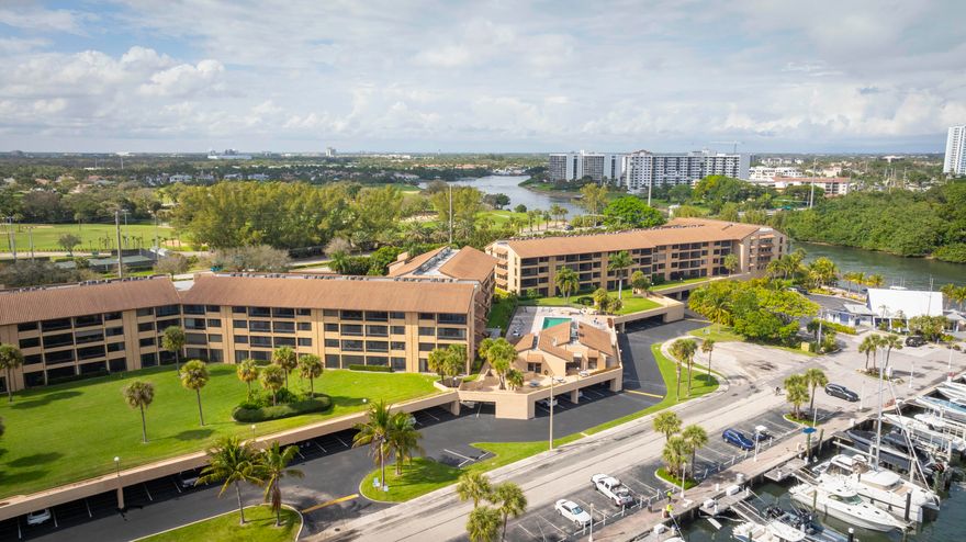 Discover coastal living at its finest in this beautifully renovated condo, perfectly situated near the Intracoastal Waterway and Safe Harbor Marina. This immaculately updated residence boasts marina and water views, creating a serene and picturesque backdrop for your daily life. Step inside to find a bright, airy interior, fresh paint, and elegant flooring. Nestled in a well-maintained, secure community, this condo offers easy access to the Intracoastal, pristine beaches, waterfront dining, and boating opportunities. Whether you seek a full-time residence or a vacation getaway, this move-in-ready home provides the perfect blend of luxury, comfort, and convenience.