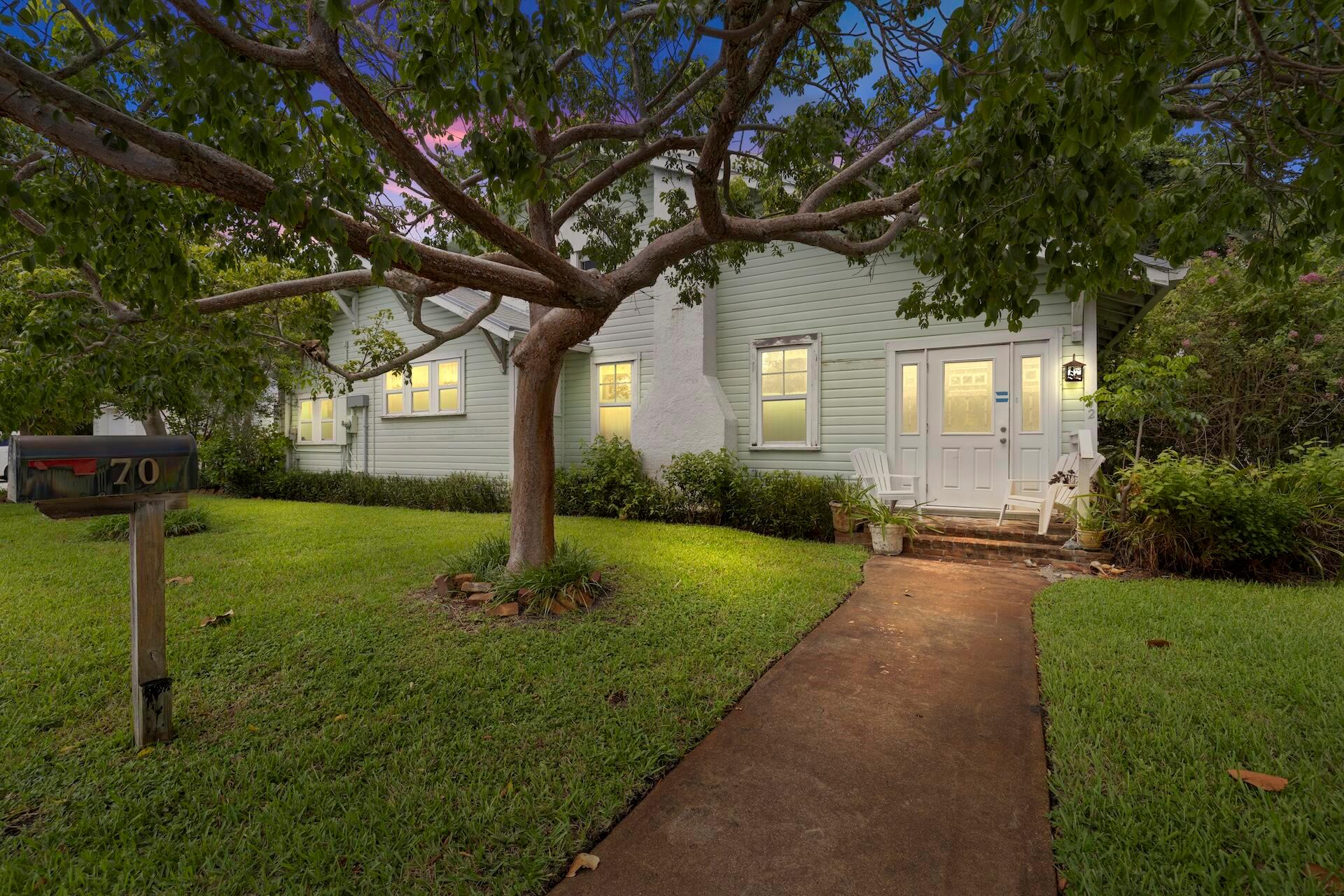 Charming Home on Swinton Avenue - Just 1 Mile from the Beach! Nestled on a desirable corner lot along Swinton Avenue, this 1925 home offers the perfect blend of location, character, and potential. Located just 7 blocks from Atlantic Avenue and only 1 mile to the beach, it's an ideal opportunity to create your dream home in the heart of Downtown Delray Beach. Step inside to find original hardwood floors, antique hardware, and classic architectural details waiting to be brought back to life. The main home features 2 bedrooms, 2 full bathrooms, and an upstairs loft space full of possibilities.Outside, a detached 2-car garage with its own loft provides excellent potential for a studio, guest suite, or workshop.