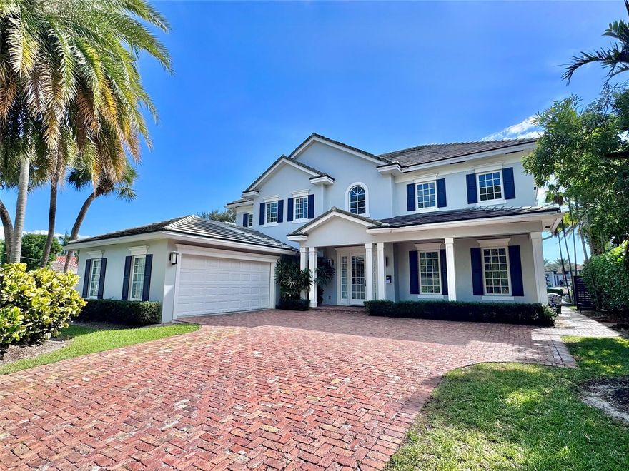 Located in the prestigious Rio Vista Isles, this stunning 5-bedroom, 5-bath offers 75 ft of waterfront living on the Rio Grenada Grand canal. Perfect for boats up to 65’, the updated concrete dock features a 40 ft floating dock that will have you on the ocean in minutes! Built in 2011, the two-story residence features Jerusalem stone flooring throughout, updated bathrooms, and a 2-car air conditioned garage. The completely redesigned backyard includes a heated saltwater pool, and an outdoor living space featuring an Alfresco outdoor kitchen and gazebo - perfect for entertaining in style in one of Fort Lauderdale’s most desirable neighborhoods.