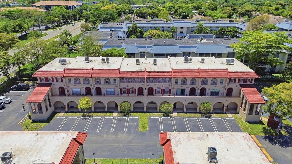 Photo of 3050 N Riverside Drive #1a, Coral Springs, FL 33065 (MLS # B26028371)