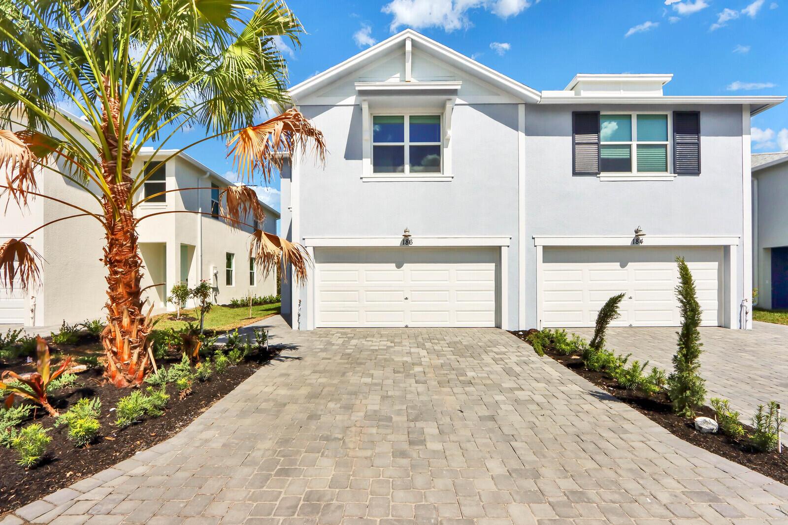 Built in 2022, this townhome is located in the heart of Jensen Beach! Offering three bedrooms, two and a half baths, plus loft with all impact windows and doors and a spacious, open floorplan! Featuring tile flooring throughout first floor, open concept kitchen/living area, second floor washer and dryer plus a two car garage! Osprey Preserve is a charming community of unique, two-unit townhomes with coastal inspired architecture. The soon-to-be gated community offers it's residents a community pool and cabana plus an ideal location near a variety of shopping, dining and beautiful beaches