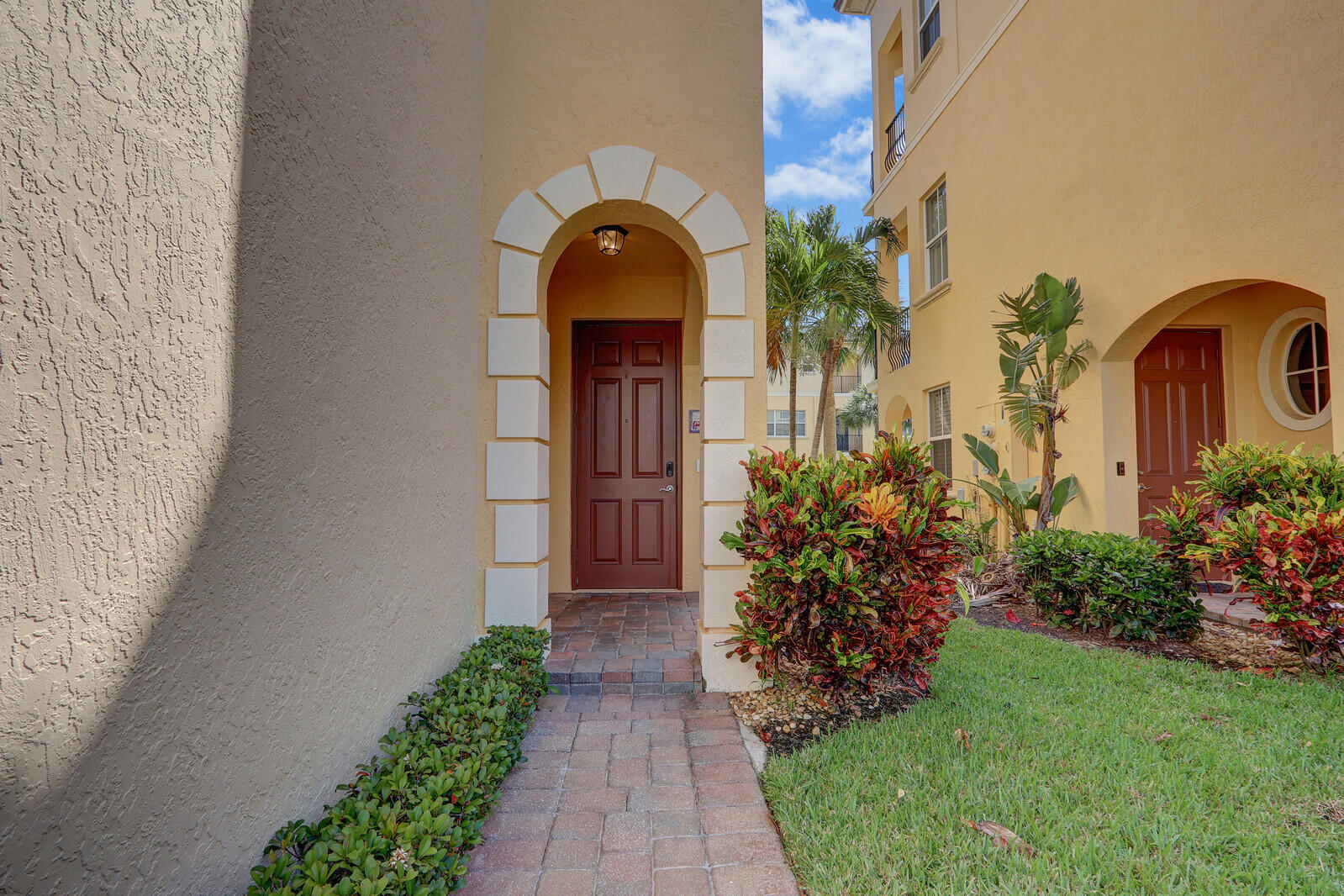 Must See end unit in Ocean Bay Villas Hutchinson Island's premier gated community. Just steps from the beach and Indian River Lagoon! This 3-story home features a private elevator, 2023 A/C, and an updated kitchen with quartz counters. Light, neutral decor and plantation shutters throughout. Enjoy impact windows, 3 balconies with palm tree views, a 2 car garage, and spacious top-floor primary retreat. Perfect as a full-time beach home, vacation getaway, or income-producing rental with owner lock-out closets. Pet-friendly community and can rent immediately up to 6x/year, 1-month min. Close to pool, hot tub, fitness center, and downtown Jensen & Stuart!
