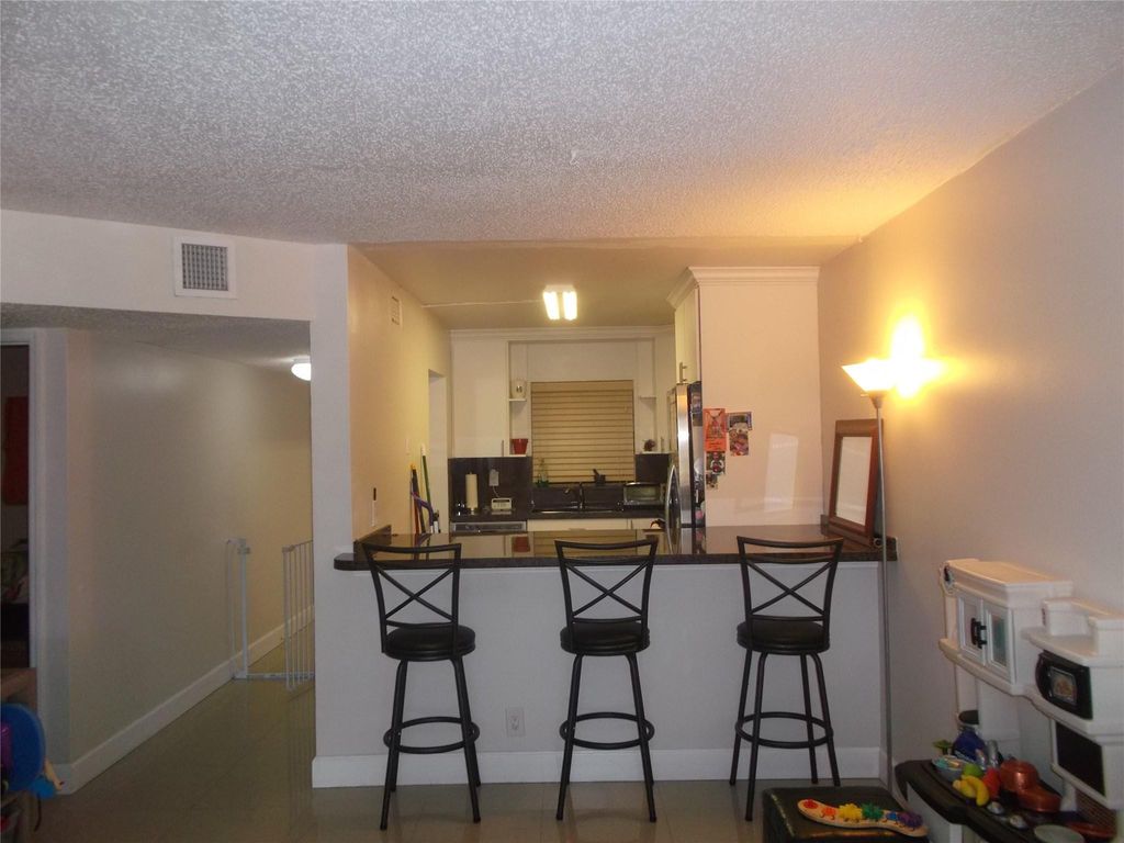 Photo of 2955 Riverside Drive #103, Coral Springs, FL 33065 (MLS # F10554278)