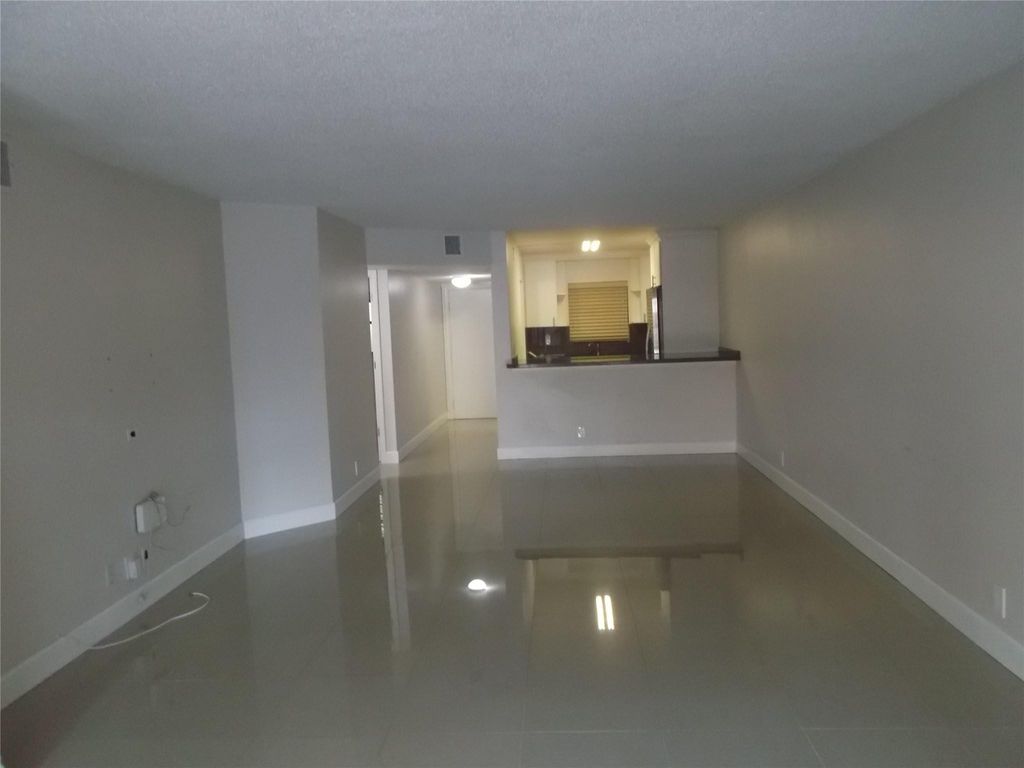 Photo of 2955 Riverside Drive #103, Coral Springs, FL 33065 (MLS # F10554278)