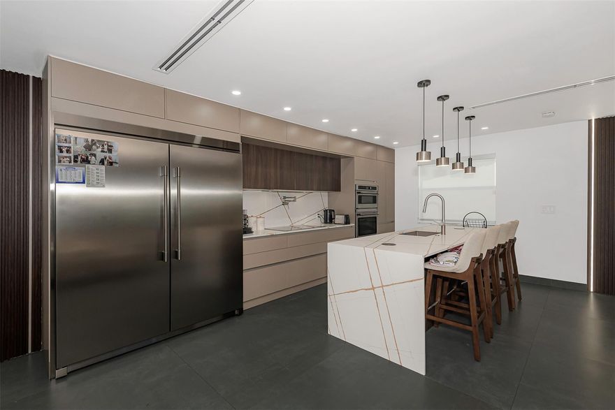 Experience luxury living in this beautifully updated 4-bedroom, 3-bath home. contemporary finishes and high-quality craftsmanship. The gourmet kitchen is a centerpiece, showcasing premium appliances, a striking waterfall quartz island, and an array of designer touches that elevate the space. Impact door and windows replacement of all cast iron pipes, ensuring long-term durability. The home also features new plumbing with copper lines, updated A/C vents. A screened-in patio and newly refinished pool area, surrounded by low-maintenance synthetic grass that adds both style and comfort. Ideally situated just a short walk from places of worship.