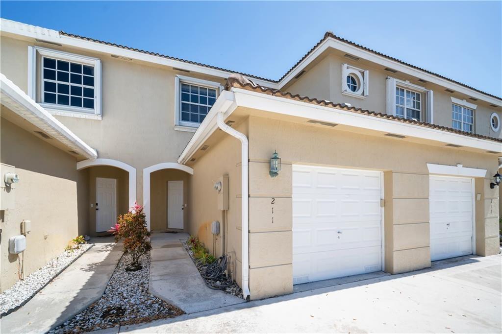 Enjoy serene lake views from this 2 bedroom, 2.5 bath townhouse in a prime location. Features include tile flooring on the first floor and laminate on the stairs and second floor. Master suite includes two walk-in closets and a renovated bathroom with dual sinks and a walk-in shower. The second bedroom also includes an en suite bathroom and walk-in closet. 1 car garage plus space for 2 additional vehicles in the driveway. Covered patio and accordion shutters for added convenience. Located in a gated community with great amenities: pool, gym, tennis courts, basketball court, playground, and clubhouse. Centrally located near Memorial Hospital West, CB Smith Park, Pembroke Lakes Mall, and offers easy access to I-75. RENT INCLUDES BASIC CABLE & INTERNET!
