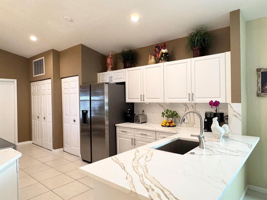 BRAND NEW ROOF! UPGRADED KITCHEN and new A/C installed September 2023. Immaculate single-family home featuring 2 bedrooms plus a den, 2 bathrooms, and a 2-car garage. Enjoy a covered patio and a private yard in The Grove, an upscale 55+ community with a 24-hour manned gate and 10 scenic lakes, ideally located in desirable West Boynton Beach.Conveniently close to shopping, dining, and just 7 miles from the ocean, with easy access to both the Florida Turnpike and I-95. Community amenities include an Olympic-sized saltwater pool, sauna, Jacuzzi, 4 Har-Tru tennis courts, shuffleboard, bocce, 2 pickleball courts, and pool tables.HOA includes lawn care, exterior house painting, cable TV, and access to all amenities and community activities.