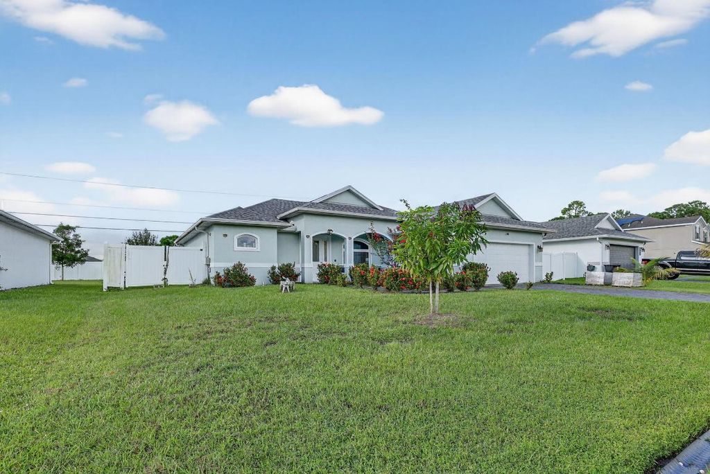 Photo of 1438 SW Calmar Avenue, Port Saint Lucie, FL 34953 (MLS # R11131216)