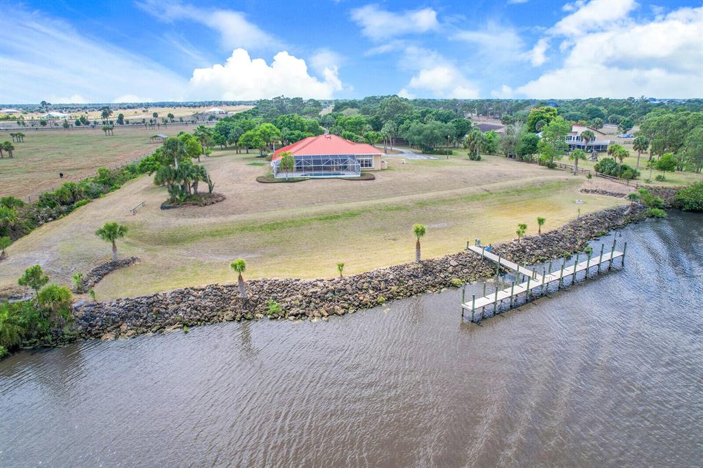 9 deep waterfront acres with nearly 370 feet along the water with a 100 foot dock with power. Located only 4.5 mile to the new Indiantown marina, 17 miles to Lake Okeechobee, and 24 miles to ocean.