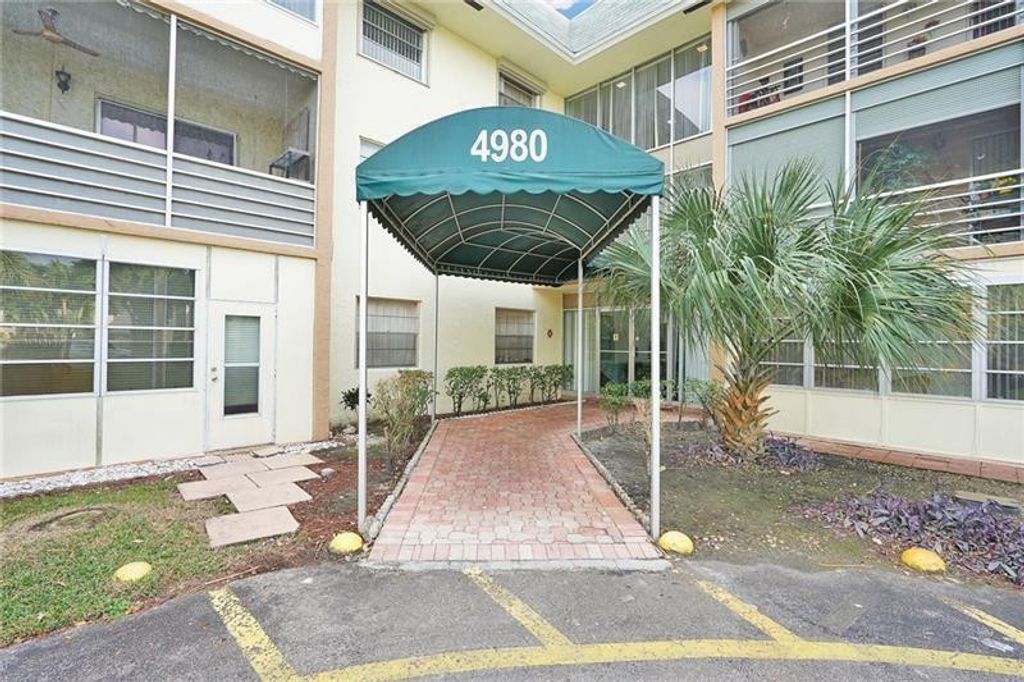 Photo of 4980 E Sabal Palm Boulevard #124, Tamarac, FL 33319 (MLS # F10527873)