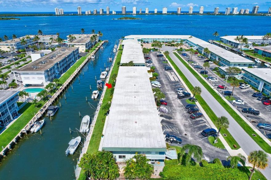 Boaters Dream!! Ocean Acess and NO Fixed Bridges, just  minutes from the PB Inlet. 2 bed/2 bath Waterfront Condo in NPB with unobstructed Water Views in this Intracoastal Waterfront Community!! Enjoy the balmy breezes & spectacular Sunrises and Moonrises! This Light & Bright condo has Impact Windows and accordon shutters, New Sliders, beautiful Laminate Wood Floors, Smooth Ceilings & Crown Molding. Updated kitchen w/ newer cabinets, granite countertops & a pantry. New AC (2024) New Electrical Panel (2023) Roof 2016. Enjoy peaceful water views from your private & spacious screened-in Lanai right off your living room and master suite!! Master suite has a large walk-in closet with built-ins,. In unit Washer & Dryer allowed. Boat docks for rent when available accommodating up to a 38' vessel. Minutes to the NPB Golf & Country Club! Close to world class golf,  beautiful beaches, great restaurants, shopping, & mins to PBIA.