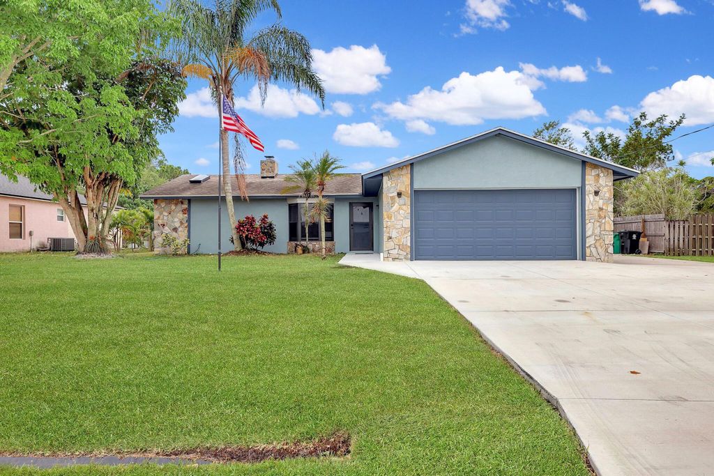 Photo of 1002 SW Provincetown Lane, Port Saint Lucie, FL 34953 (MLS # R10983985)