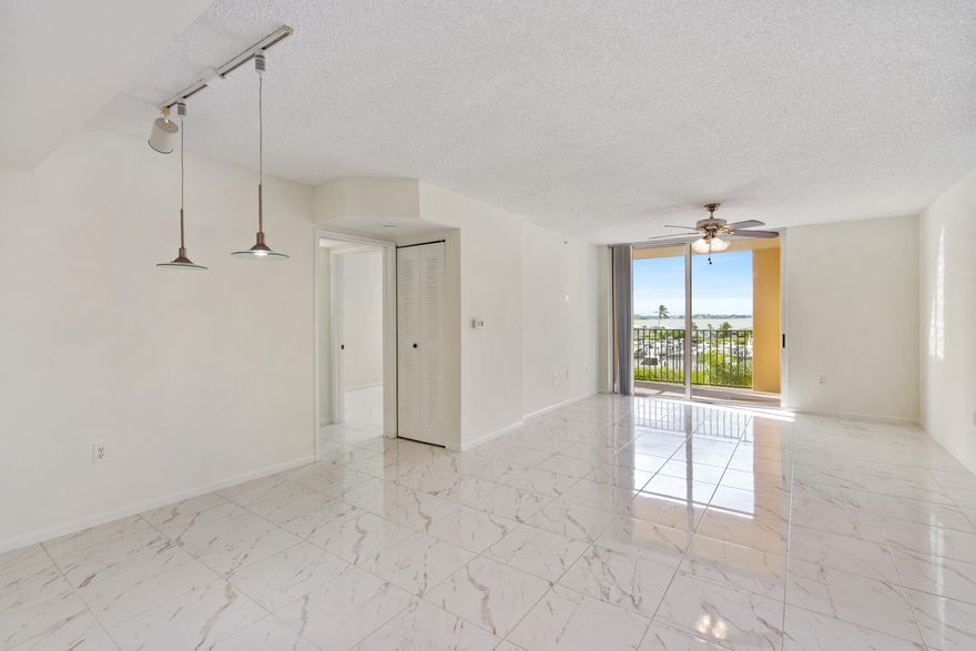 Beautiful 2-bedroom, 2-bathroom condo offering stunning Intracoastal views from both bedrooms and the private balcony. This unit features tile flooring throughout and fresh interior paint, creating a bright and inviting living space. Enjoy a desirable southeast exposure that fills the home with abundant natural light and refreshing coastal breezes.  The spacious layout includes a walk-in closet and the convenience of an in-unit washer and dryer. A detached one-car garage is included, offering added flexibility and value. The property is just a short walk to private beach access and canoe storage—perfect for embracing the waterfront lifestyle.