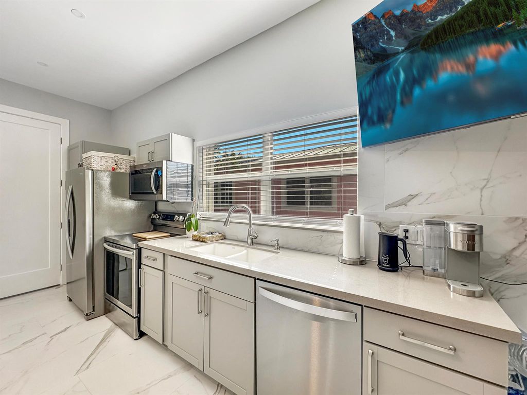 Photo of 312 Claremont Lane #Apt., Palm Beach Shores, FL 33404 (MLS # R10980262)