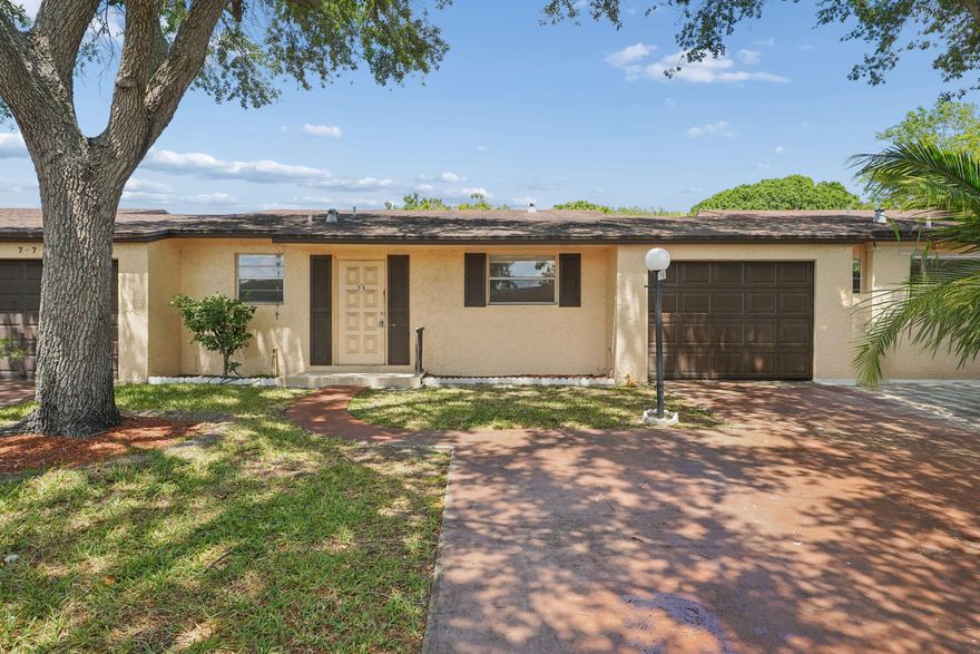 An amazing opportunity in the desirable Garden Patio Villas! This bright 2-bedroom, 2-bath villa features a split-bedroom floor plan and a versatile extra room, perfect for an office, den, or guest space. Brand-new vinyl laminate flooring and a 2025 AC unit provide modern comfort and peace of mind throughout. Roof listed as 2022 per insurance records; seller has no additional documentation available.  Step outside to a private enclosed patio and oversized side yard with space for a garden or lounge area. One-car garage plus driveway parking for two additional vehicles. Located in a well-kept community near shopping, dining, parks, and major roadways, this villa offers comfort, convenience, and value - an excellent opportunity to make it your own!