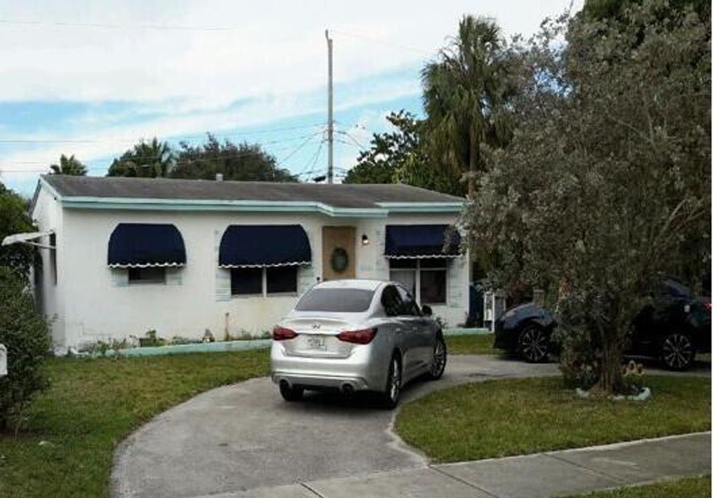 Photo of 6041 NE 3rd Terrace, Oakland Park, FL 33334 (MLS # B26008089)