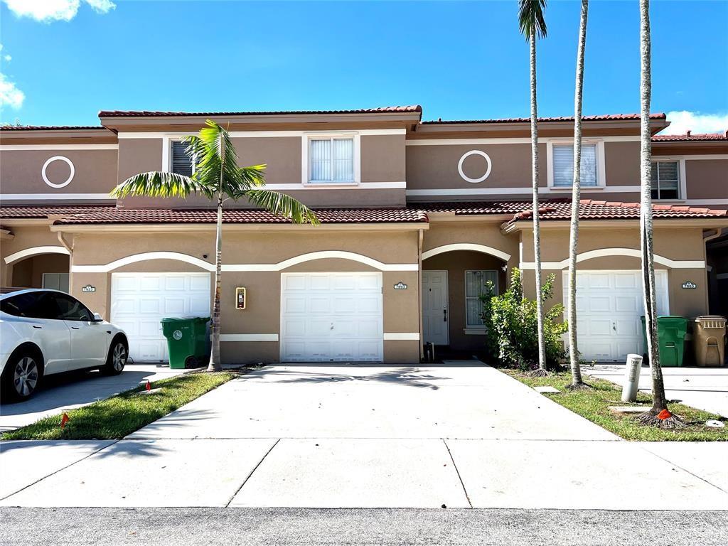 Beautiful Gated 4-bedroom, 3-bath townhouse in a prime Central Broward location! Conveniently situated near Nova Southeastern University, the Hard Rock Casino, major highways, and multiple shopping centers. This home features an open layout with hard laminate flooring throughout, stainless steel appliances, and a washer/dryer included. Ceiling fans are installed in all bedrooms, and large closets provide ample storage. Enjoy a screened-in patio and a 1-car garage.
