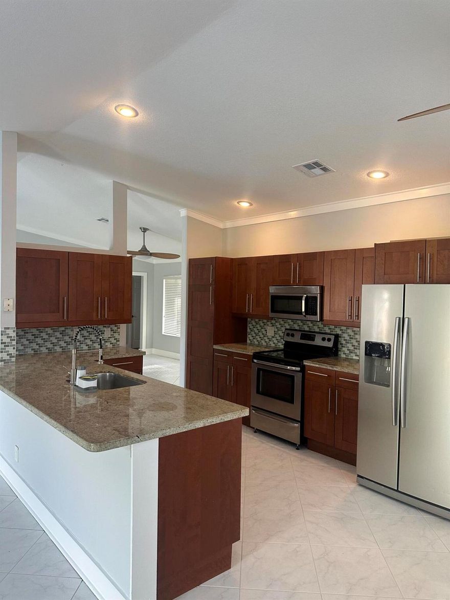 Beautiful Lakeview home in the area of WINSTON PARK neighborhood! Light and Bright, open concept, Modern Kitchen with Wood Cabinets, Stainless Steel Appliances,Granite Counters,Tile and Laminated Wood Floors, Walking Closet, Great Patio for entertaining, Sprinkler System, Brand New AC unit, 2 Car Garage. Community close to the best Shopping and Dinning, Easy access to the Turnpike and Sawgrass Expressway. Ready to Move In.