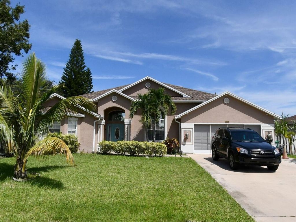 Photo of 1937 SW Davis Street, Port Saint Lucie, FL 34953 (MLS # R11084159)