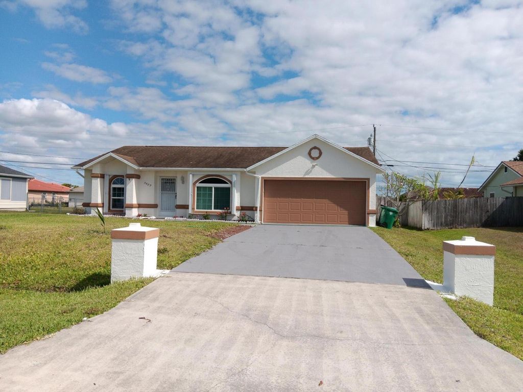 Photo of 5489 NW Evanston Avenue, Port Saint Lucie, FL 34983 (MLS # R10976167)