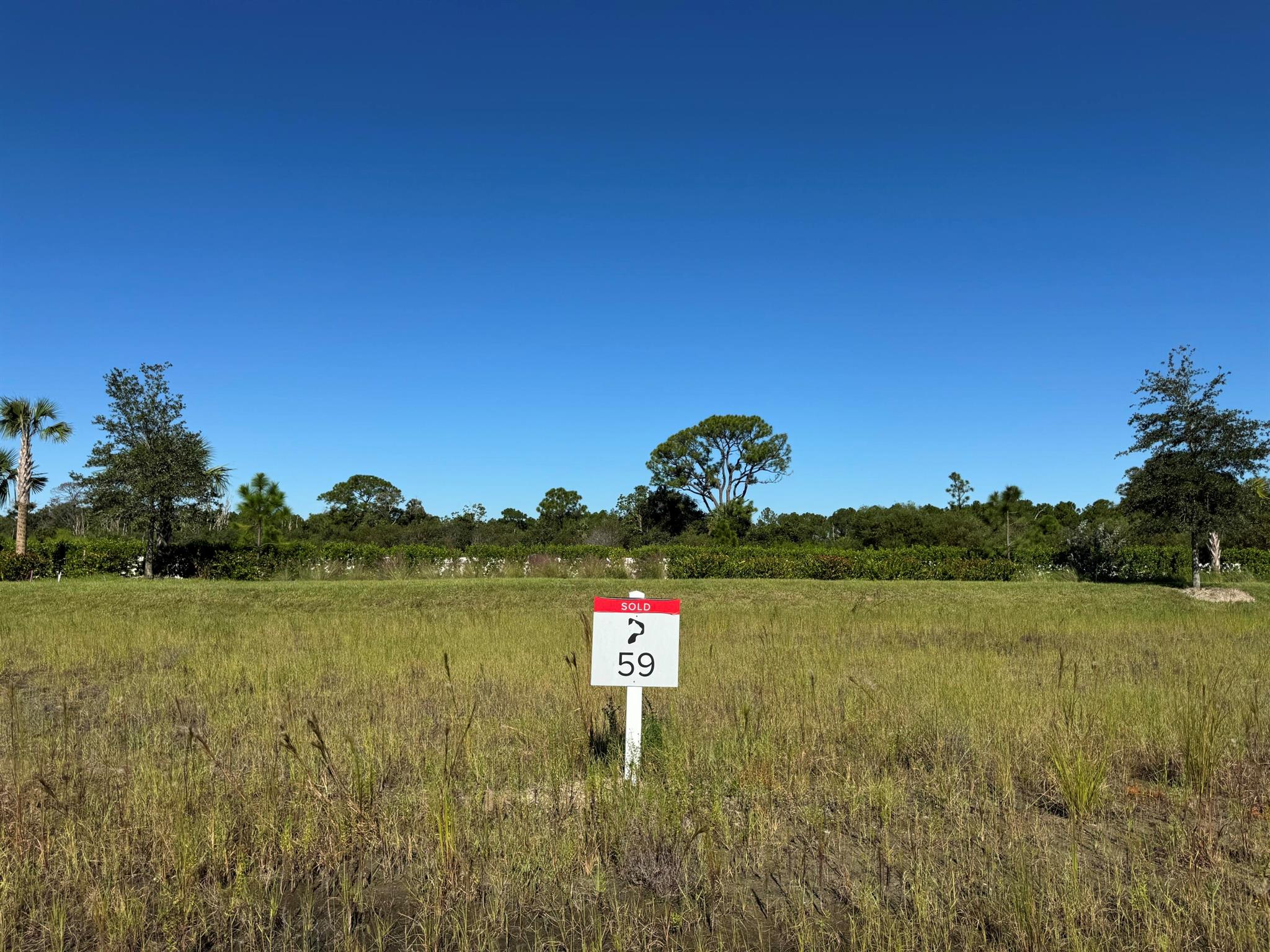 Surrounded by a 2,400-acre nature preserve, this stunning half-acre custom homesite offers unparalleled privacy and breathtaking views. Set within the exclusive Panther National Golf Club--home to Florida's recently rated #1 residential golf course--this property presents a rare opportunity to custom design and build your dream home in one of the most extraordinary settings.  Experience the ultimate in luxury living at Panther National Golf Club.