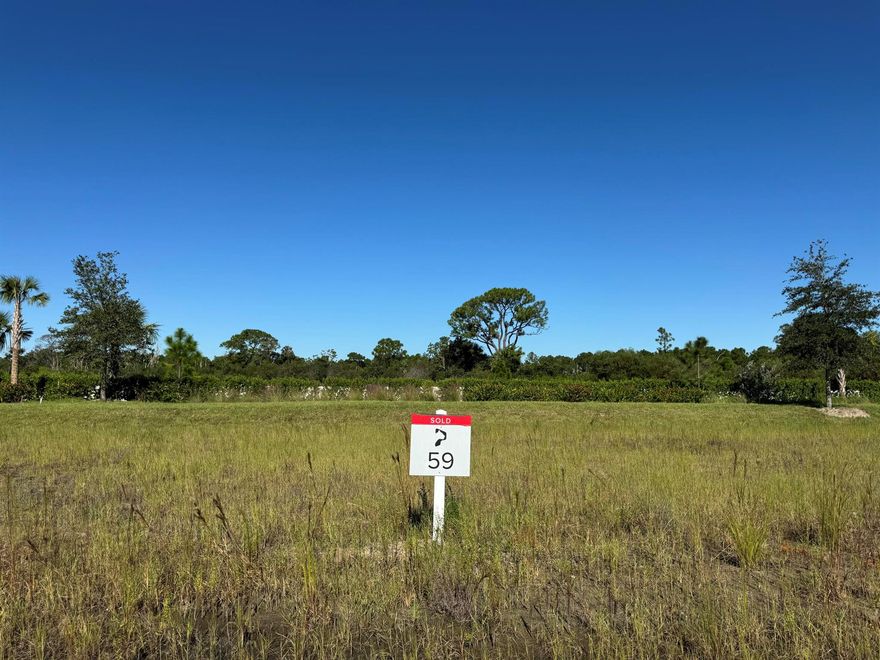 Surrounded by a 2,400-acre nature preserve, this stunning half-acre custom homesite offers unparalleled privacy and breathtaking views. Set within the exclusive Panther National Golf Club--home to Florida's recently rated #1 residential golf course--this property presents a rare opportunity to custom design and build your dream home in one of the most extraordinary settings.  Experience the ultimate in luxury living at Panther National Golf Club.
