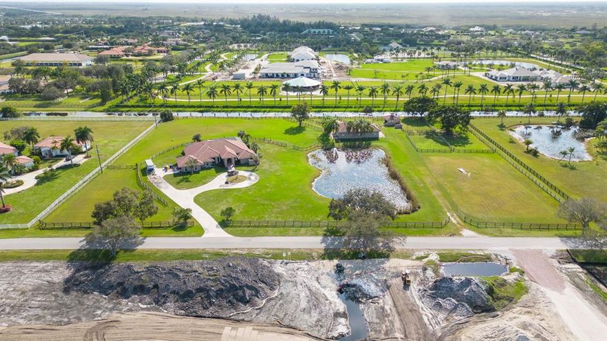 This beautiful horse property boasts an idyllic location on over 5 acres in the coveted equestrian community of Palm Beach Point. Easily hack to the show on bridle paths without crossing any major roads! The property is ideally set up with a separate entrance to the equestrian amenities which include a CBS 8-stall barn with tack and feed room, 5 large run outs on one side, a separate CBS equipment building, grass riding field, 4 medium paddocks plus 2 oversized paddocks. The stately residence boasts just shy of 3,000 sq ft of living space with 3 bedrooms, 2 full and 1 half bathroom, 2-car garage, large in-ground free-form pool plus a spa and a private circular driveway.