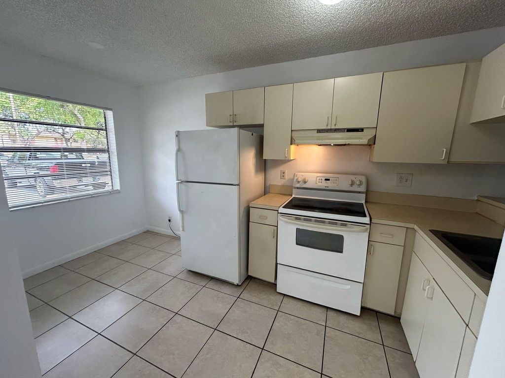 Photo of 4099 Lakeside Drive #4099, Tamarac, FL 33319 (MLS # F10496369)