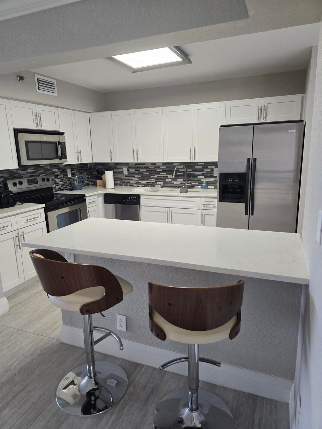 Photo of 7580 Regency Lake Drive #402, Boca Raton, FL 33433 (MLS # B26045905)