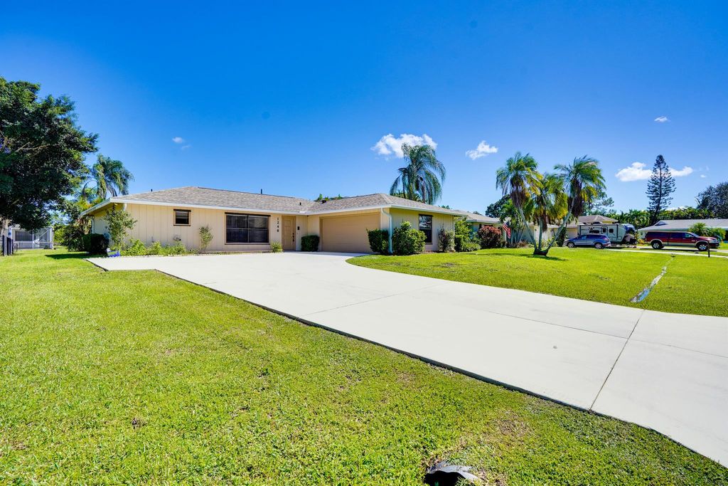Photo of 1248 SE Palm Beach Road, Port Saint Lucie, FL 34952 (MLS # R11132810)