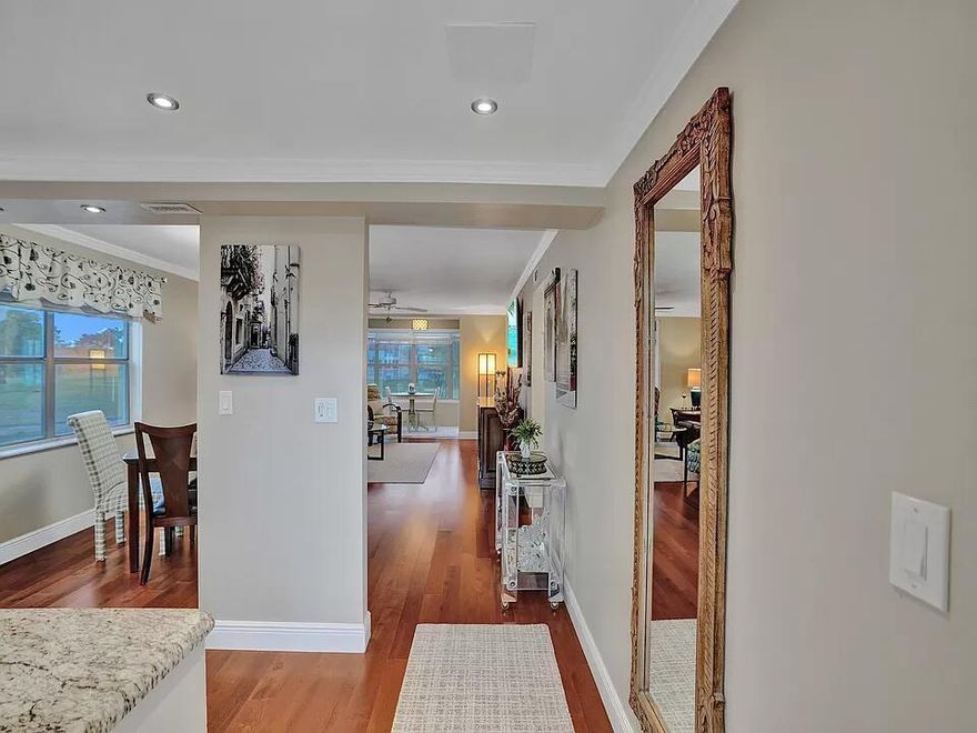 This condominium in Sunrise Lakes Phase III, Inc 2 is a "Luxury" unit. Sunrise Lakes Phase III contains three different types of 2 bedroom, 2 bath condominiums - a "Standard" unit of 850 square feet, a "Deluxe" unit of 1,025 square feet, and a "Luxury" unit of 1,146 square feet. All "Luxury" units are end units (with extra windows). Phase III has 3,500 condominiums. Of those, only 120 are "Luxury" units with the most desirable of them being on the 2nd floor (Perceived security concerns with the 1st floor and stair-climb issues with the 3rd floor). There are only 40 of these most coveted 2nd floor condominiums in all of Phase III. This unit is on the 2nd floor with a beautiful lake and golf course view!  The most comprehensive renovation in Phase III was performed on this unit and finished in 2023. Every square inch has been touched and improved by professionals. It includes: A complete new kitchen with custom all wood soft-close cabinets featuring under-cabinet multi functional lights, stainless steel appliances, granite counter tops, and a ceramic backsplash. New electrical wiring and switches. All "popcorn" removed from ceilings and ceilings raised and smoothed with conduits buried inside for no visible lines to fixtures such as fans. Hardwood floors. New 6" baseboard moldings and crown moldings. New doors and door hardware. Replacement high capacity water heater. Cordless premium blinds in all windows. Top shelf, quiet ceiling fans. Contemporary modern ceramic bathrooms with new vanities, toilets, faucets, etc. Trane HVAC system with infrared sanitizing. In-ceiling LED lighting. Cable lines buried inside walls with no visible cables to TV. Impact glass on lanai. And much more...  Sunrise Lakes is a 55+ community which provides amenities including the main clubhouse featuring a gym, theater/ball room, racquetball court, indoor pool, billiard room, outdoor pool, BBQ stations and more. Additionally, there are 5 satellite clubhouses, 7 pools, tennis courts, pickle ball courts, shuffleboard and a 9 hole no-fee private golf course.  A word about condo dues - Included in the monthly dues, and exclusively in Inc 2, are: 200+ cable stations, super fast internet, insurance, building maintenance, home appliance and A/C repair insurance, pest control, water, inexpensive laundry facilities, and full funding of state-mandated reserves for the next 30 years. Only condominiums in Inc 2 meet all state reserve requirements.  Furniture is negotiable.