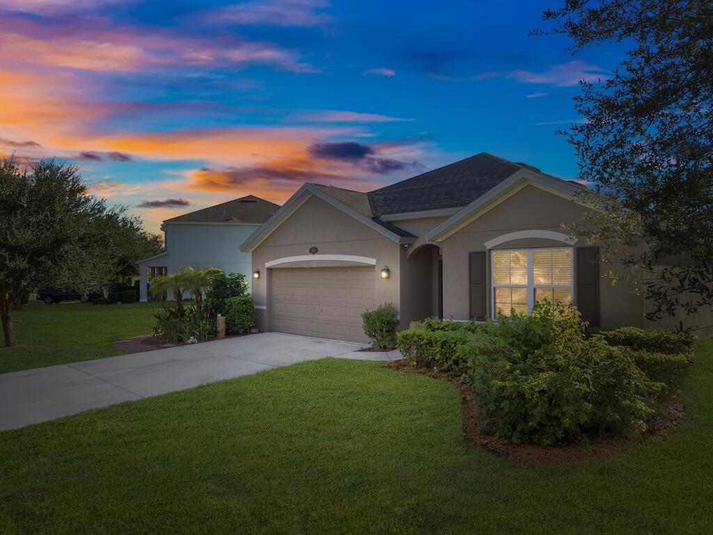Enjoy peaceful mornings on your covered patio overlooking the tranquil lake. This beautifully maintained 4-bedroom, 2-bath, 2-car garage home sits on one of the largest lots in this sought-after gated community, offering both space and serenity. The open floor plan features tile throughout, a modern kitchen with granite countertops, and stainless steel appliances--blending comfort and style seamlessly. Both bathrooms include matching granite finishes for a cohesive, upscale look. With lawn care included, this property offers effortless living in a well-kept neighborhood. This home has been lovingly cared for--come see for yourself!