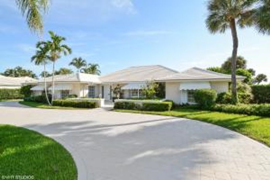 This spectacular Bermuda inspired golf course estate features, 3 bedrooms, 3 baths and is located on one of the best lots in Lost Tree Village enjoying 15th & 16th Fairway Views, just 1-block from the Atlantic Ocean. This lushly landscaped property with beautiful mature trees sprawls over a 3/4 acre lot buffered further by beautiful mature trees & the fairways beyond. It's spacious open floor plan features a courtyard entry, a spacious living room with bay windows & volume ceiling, which opens into the family room, and beyond to an open terrace. For the gourmet aficionado, the kitchen is light & bright, featuring a center island with cooktop as well as a Sub-Zero refrigerator/ freezer with matching cabinetry doors, perfect for preparing your culinary delight. Close-by is the formal dining
