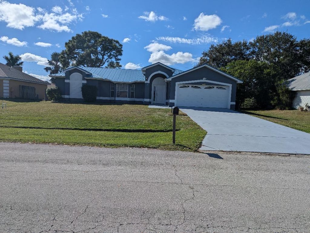 Photo of 1122 SE Puritan Lane, Port Saint Lucie, FL 34983 (MLS # R11148198)