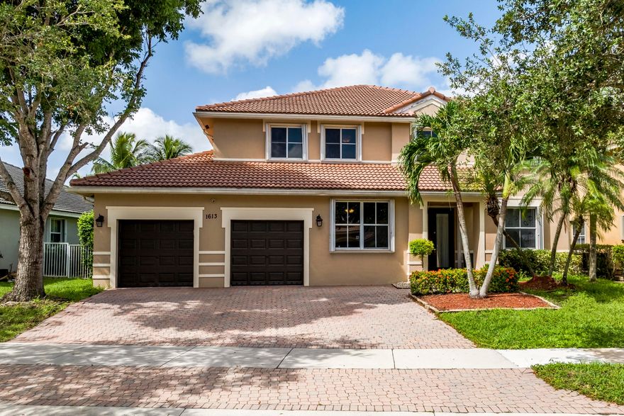 Spacious home in Weston's prized Savanna community!  Six bedrooms:  two on the main floor and the MBR and three more on the second level.  Two bathrooms down and two up.  Large tile flooring throughout the main level, with wood in the bedrooms and tile in the bathrooms on the second level.  Double-high ceiling in the living room.  Formal dining room.  The kitchen offers granite counters and backsplash and espresso cabinets.  Large fenced backyard with pool and heated spa.  Accordion shutters make it easy to prepare this large home for a storm.  Spectacular community amenities include playing fields, a resort-style pool, a regulation lap pool, and a water slide with its own pool.  Don't wait make all this yours!  This home comes with a one-year home warranty.