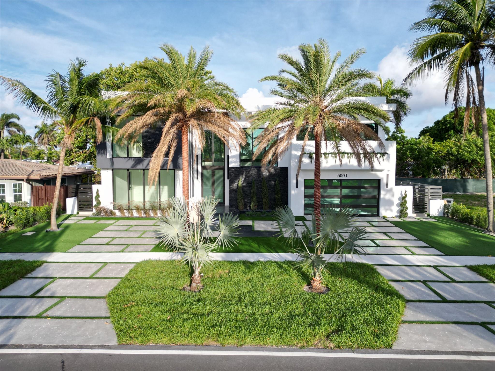 Welcome to your dream home in Lighthouse Point! With 4 beds & 4.5 baths This stunning new full concrete construction build has everything you’ve been looking for—sleek tile floors throughout, impact windows that bring in tons of natural light, and a spacious 2-car garage.
The open kitchen is a chef’s paradise with Miele appliances, a built-in coffee maker, and a walk-in pantry you’ll love. The ground-floor suite is perfect for guests or multi-generational living.
Step outside to your backyard oasis - gorgeous pool, marble patio, and plenty of space to relax. All wrapped up with a modern concrete and aluminum fence for privacy.
Whole home audio system & video surveillance with sleek illuminated accents on the polished concrete driveway.
This is a lifestyle. Come see it for yourself!