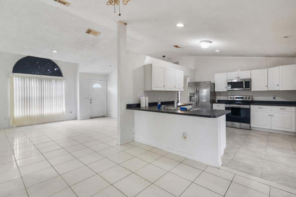Photo of 1561 SW Curry Street, Port Saint Lucie, FL 34983 (MLS # R10971830)
