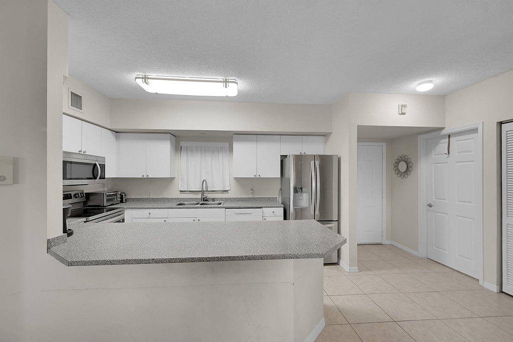 Photo of 2105 Lavers Circle #500, Delray Beach, FL 33444 (MLS # R11106908)