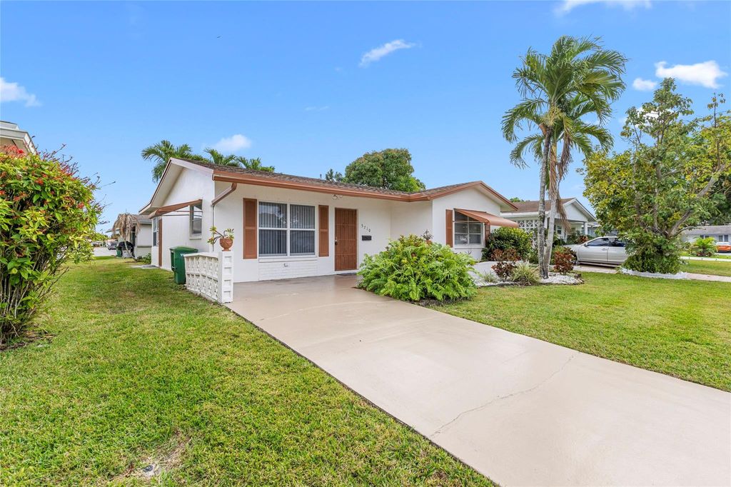 Photo of 5710 NW 68th Terrace, Tamarac, FL 33321 (MLS # F10548109)