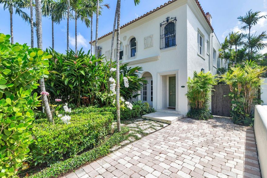 Don't miss this charming townhome in the heart of town just steps to Worth Avenue and restaurants. Beautifully updated this 2,184 sq. ft. 4 Bedroom 3.5 bath has vaulted ceilings, a fireplace, Chef's kitchen with Thermador gas stove, hardwood flooring, built in cabinetry and French doors opening to a sun-drenched courtyard and heated spa. The detached 1 bedroom one bath guest cabana has telescoping sliding doors providing a lovely area for entertaining. Lush tropical landscaping provides total privacy. Meticulously maintained, this special home is move in ready!