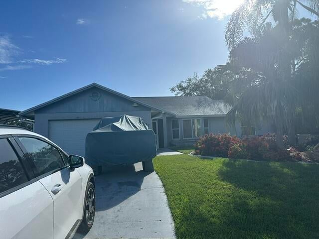 Photo of 1697 SW Schleicher Lane, Port Saint Lucie, FL 34984 (MLS # B26072524)