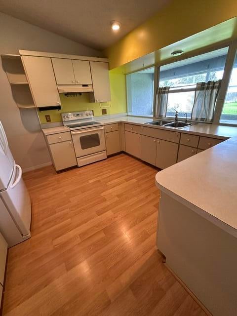 Photo of 1697 SW Schleicher Lane, Port Saint Lucie, FL 34984 (MLS # B26072524)
