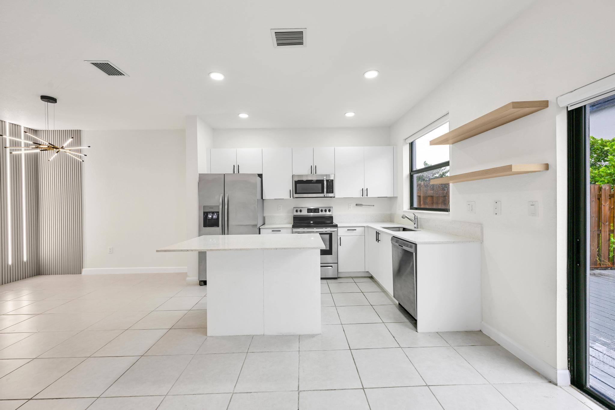 Don't miss this beautifully detailed home in a desirable gated Homestead community! Featuring quartz countertops, a spacious kitchen island perfect for gatherings, a custom designer accent wall, modern lighting, and quality blinds, this home is ready for your personal touch. Relax on the ample patio deck or enjoy community amenities including a clubhouse, gym, and pool. Conveniently located near major highways, shopping, dining, and more. Ideal as a primary residence or investment property. Schedule your private showing today!
