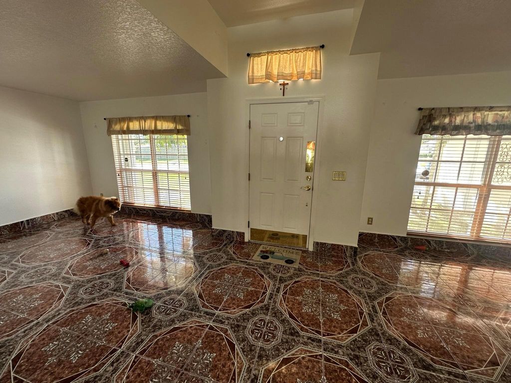 Photo of 1361 SW Gastador Avenue, Port Saint Lucie, FL 34953 (MLS # R10975195)