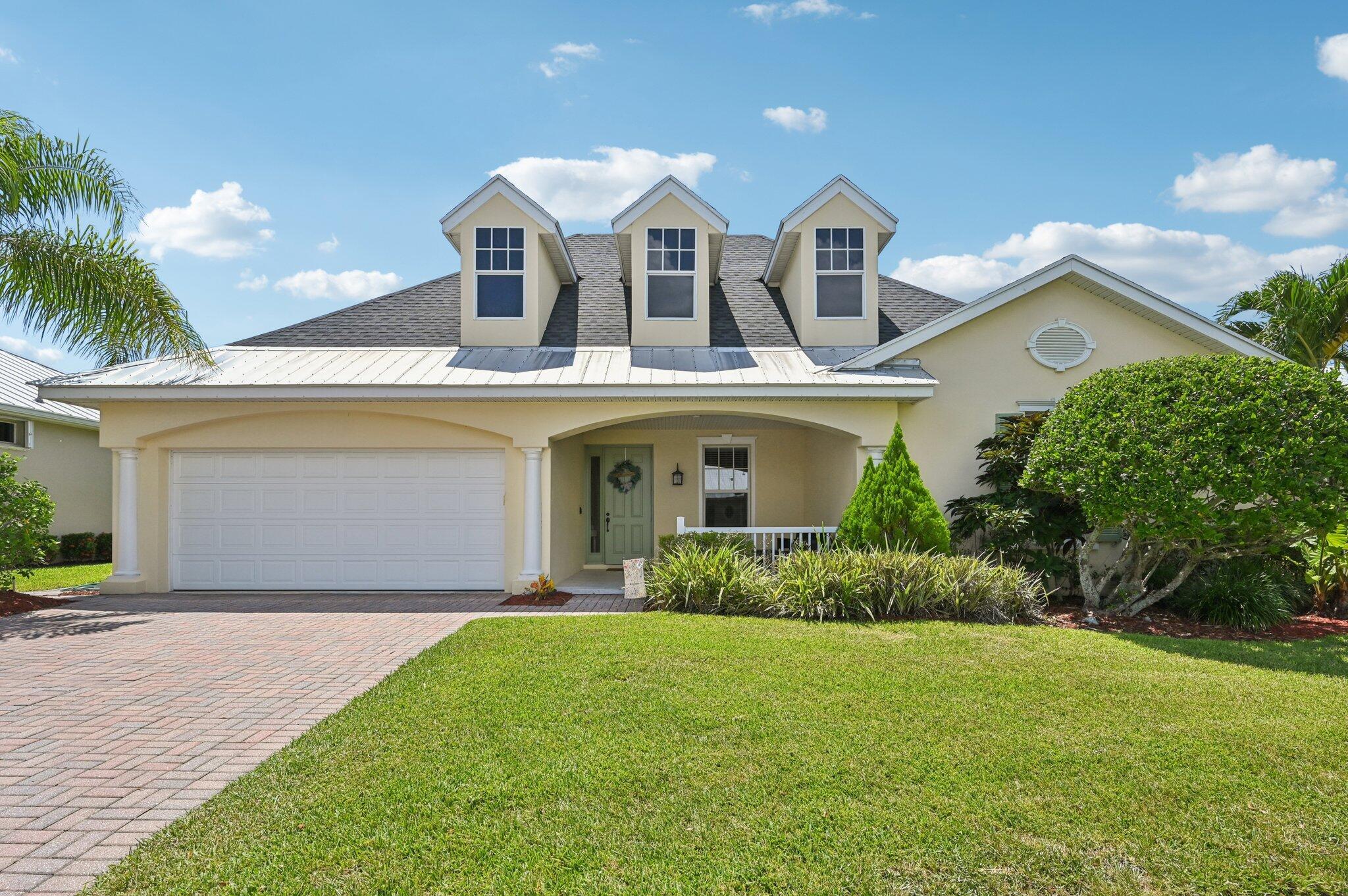 Charming Curb Appeal with Spacious Interior & Resort-Style Living! This inviting home captures attention with its eye-catching curb appeal, featuring three architectural dormers and a spacious front porch that sets the tone for relaxed Florida living. Just inside, you'll be drawn in by the spacious open floor plan, featuring a large family room and tile flooring throughout the main living areas. A custom-built bar area adds the perfect touch for entertaining guests. The dedicated office includes built-in shelving for ample storage, and the formal dining room impresses with coved ceilings and detailed wainscoting. The expansive kitchen offers granite countertops, stainless steel appliances, a large pantry, center island seating, and a breakfast area -