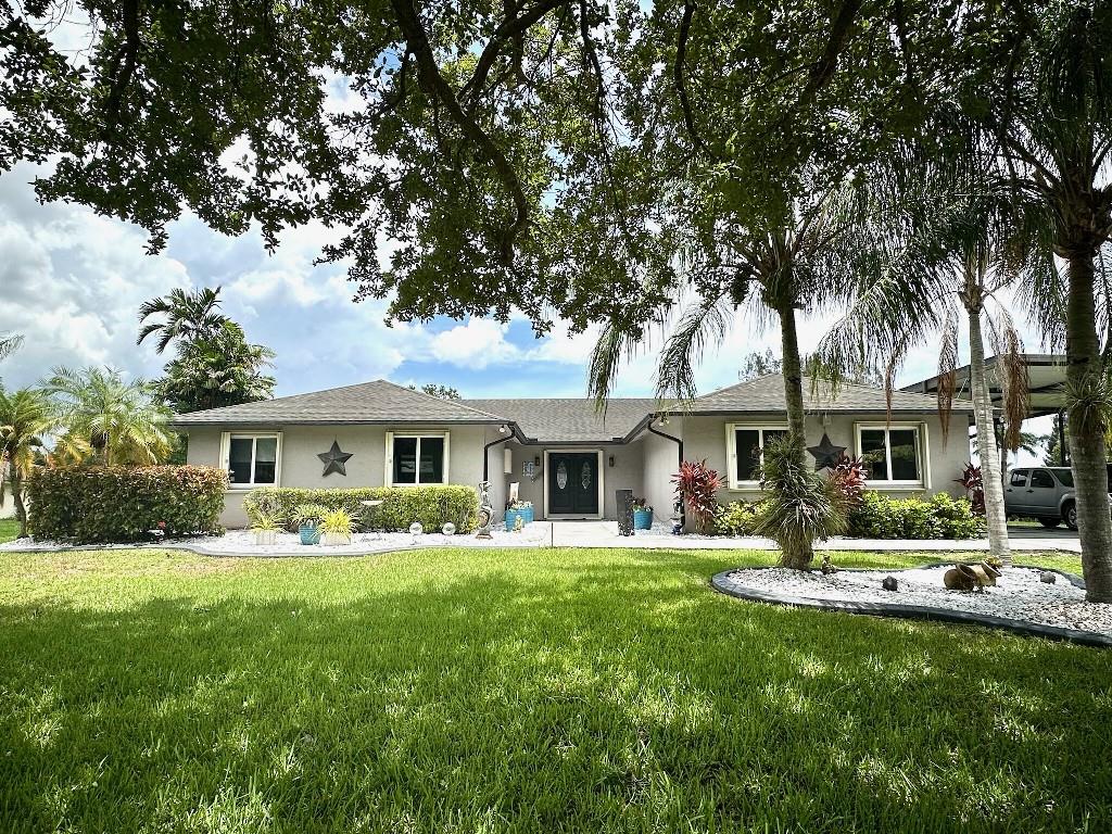 Beautiful 4-bedroom, 2.5 bathroom custom-built home situated on 1.24 acres of private land located in Southwest Ranches. Recent upgrades include all new modern Kitchen, Great Room, Dining Room, and Living Room. This home is perfect for entertaining or just enjoying life - featuring a spacious open floor plan, gourmet modern kitchen, cozy fireplace, expansive covered patio, solar heated pool, covered carport, and beautifully textured sidewalk and driveway. This house was heavily reinforced during construction and includes impact windows and doors, and accordion shutters for added peace of mind. With no HOA fees, this property can be completely personalized to your liking!